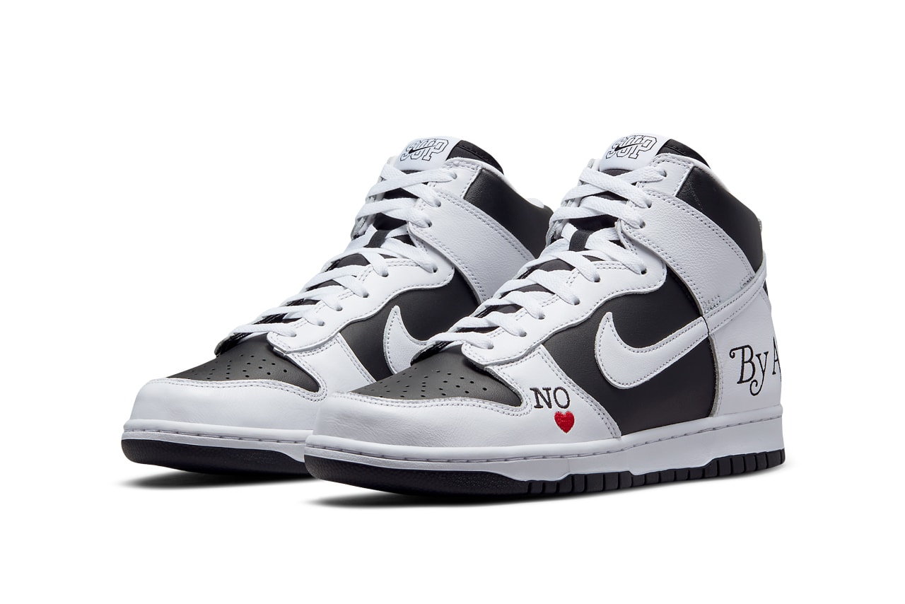Supreme x Nike SB Dunk High “By Any Means” in "Black/White" front view