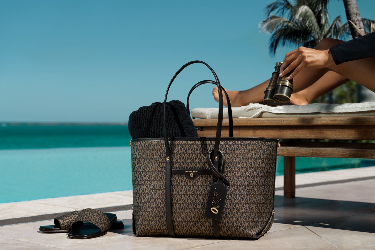 michael michael kors 007 bond exclusive limited edition capsule collection cindy bruna bella hadid luggage handbags swimwear footwear ready-to-wear pieces bond signature print suitcase beck weekender bag