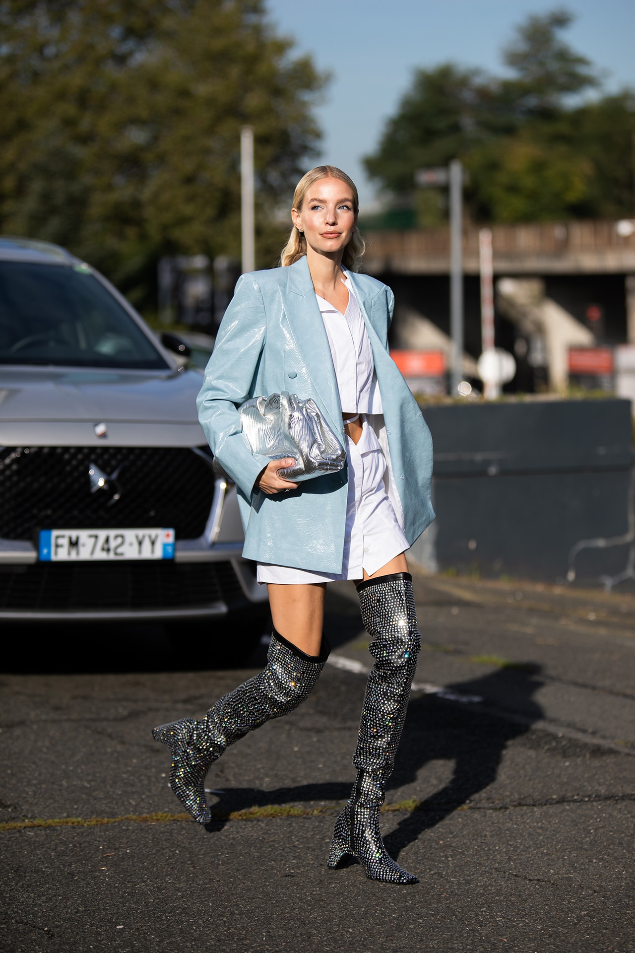 Paris Fashion Week Spring Summer 2022 SS22 Street Style Look Outfit Influencer Blue Jacket Sparkly Boots Silver Bottega Veneta Pouch Bag Clutch