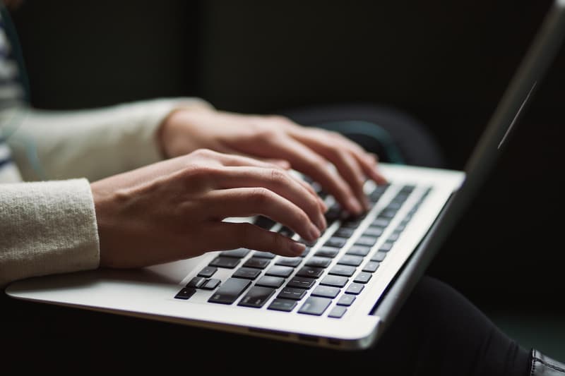 computer laptop working typing hands keyboard