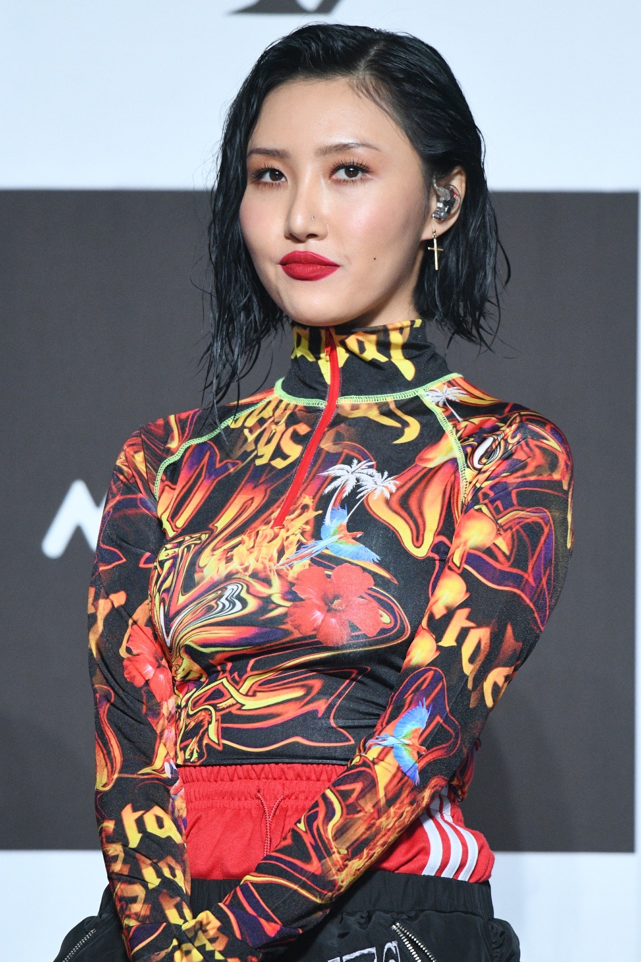 mamamoo hwasa posing colorful outfit black hair red lipstick earpiece gold earring 