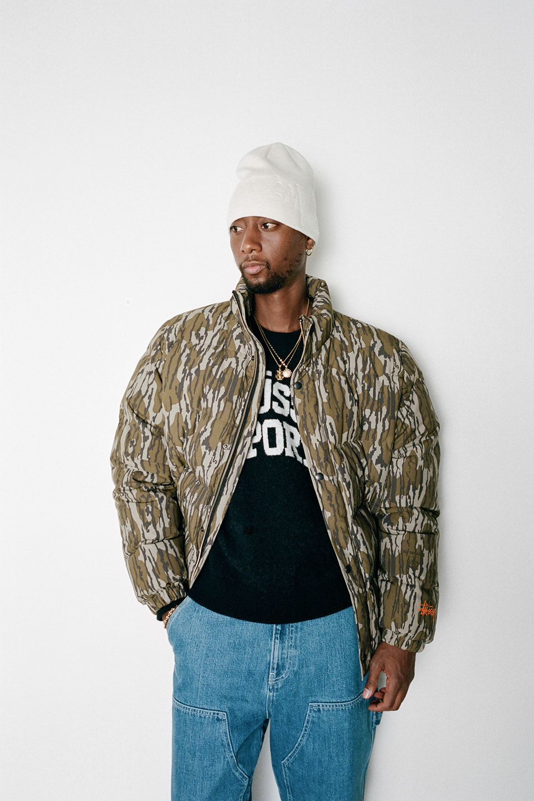 stussy holiday 2021 collection jacket shirt jeans beanie