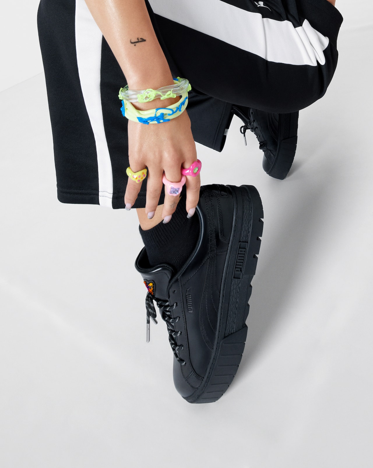 dua lipa puma campaign flutur butterfly footwear apparel black sneakers