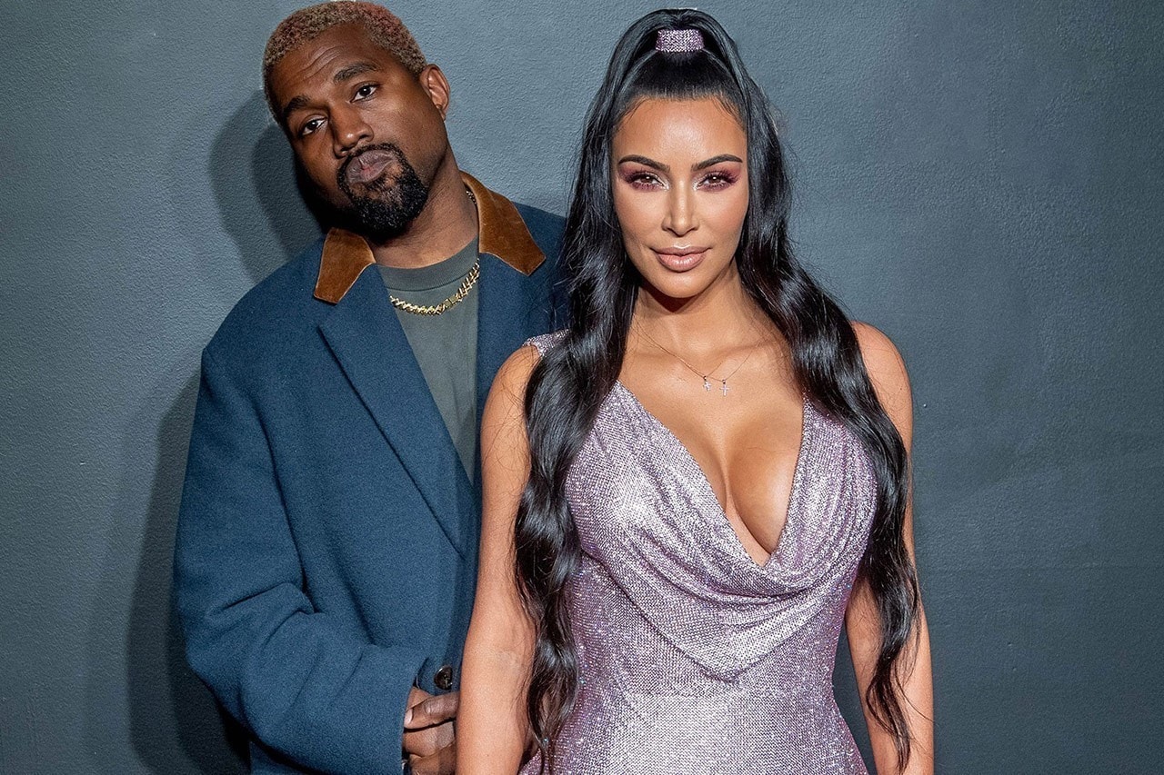 kanye west kim kardashian pose against wall buys home hidden hills across from estranged wife