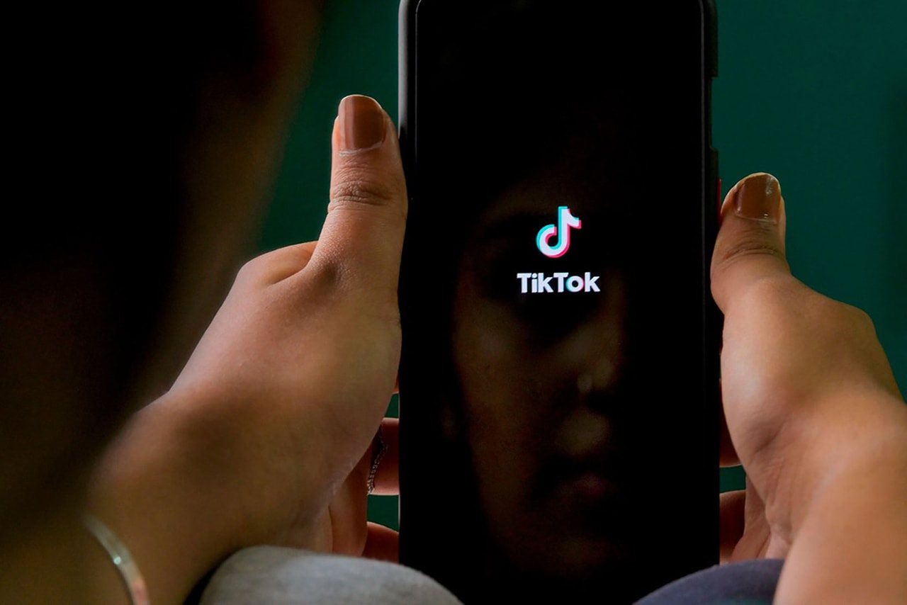 Person Using TikTok Phone Social Media