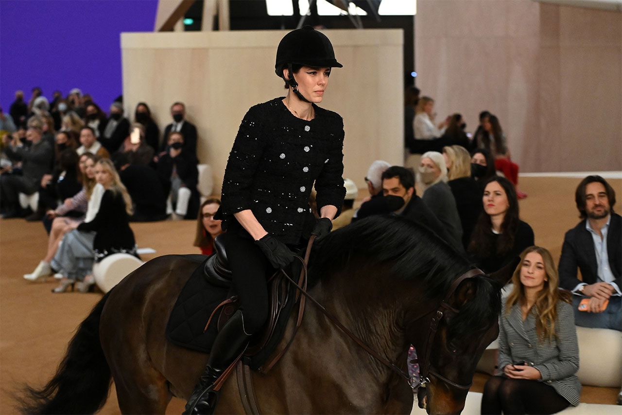 Charlotte Casiraghi rides a horse on the runway during the Chanel Haute Couture Spring/Summer 2022 show as part of Paris Fashion Week at Le Grand Palais Ephemere on January 25, 2022 in Paris, France