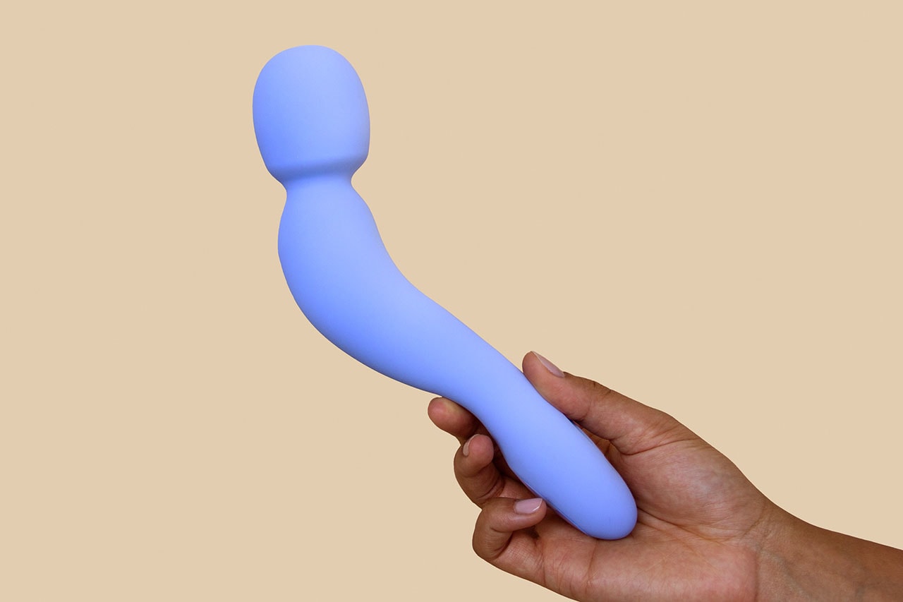 Dame Products Com Sex Toy Wand Vibrator Periwinkle Blue Held Against Yellow Backdrop