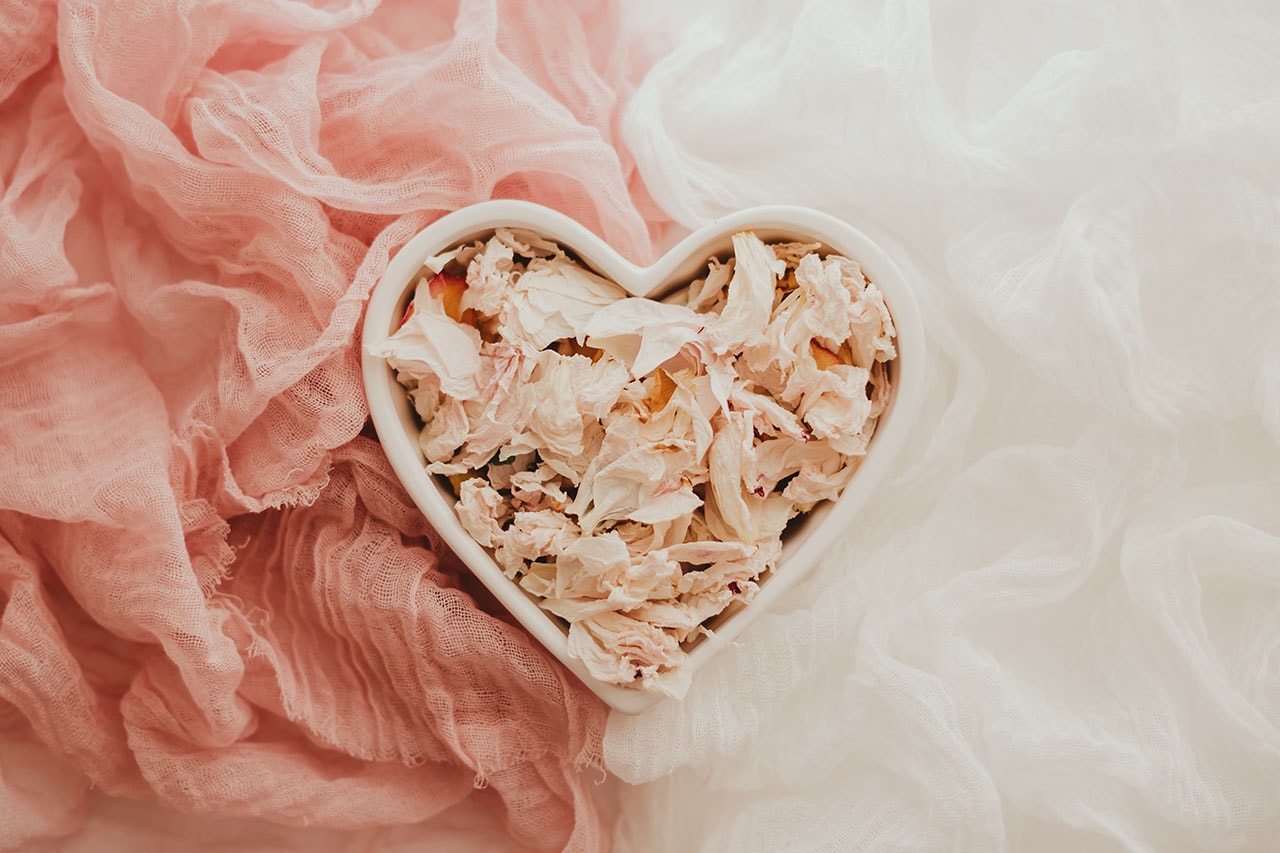 Blush colored flowers In the shape of a heart 