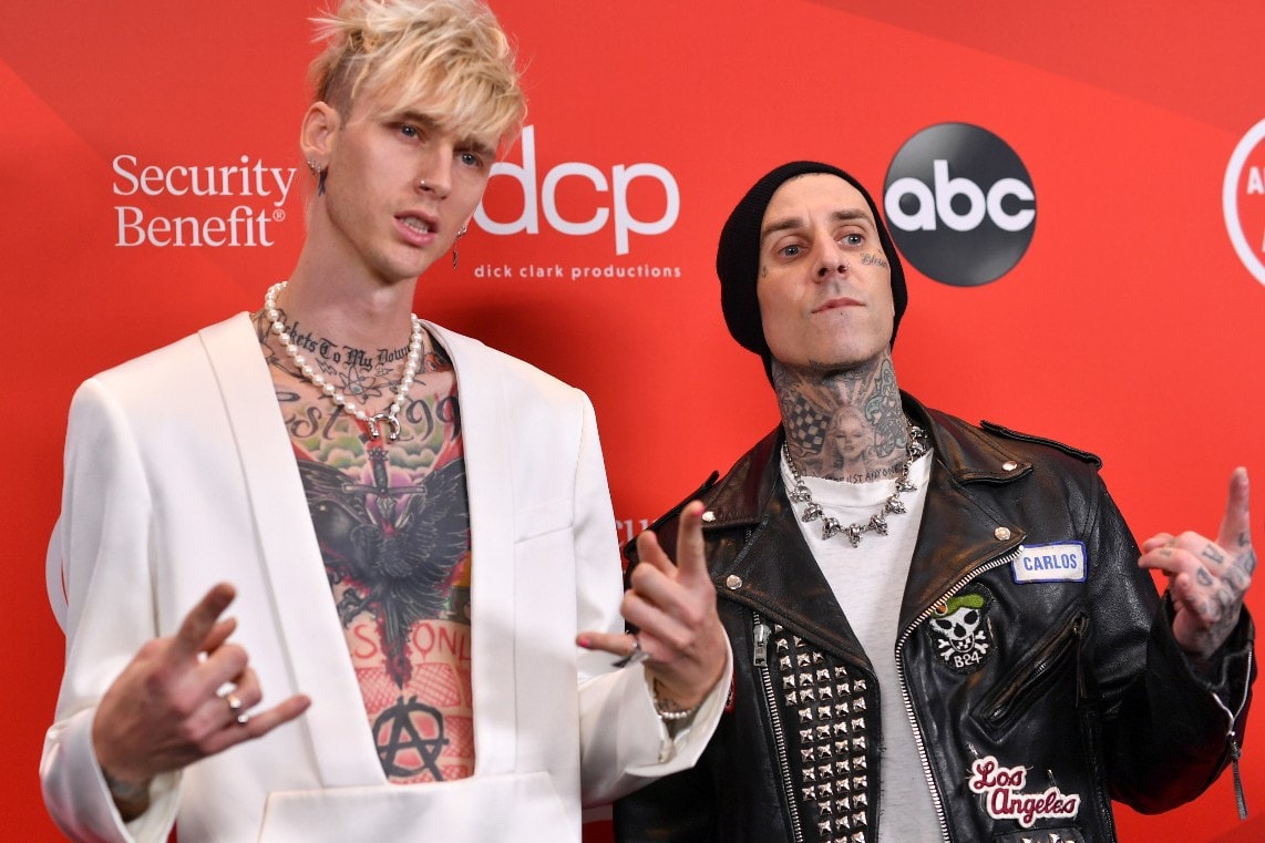 machine gun kelly travis barker upcoming album name change title mainstream sellout born with horns matching arm tattoos 
