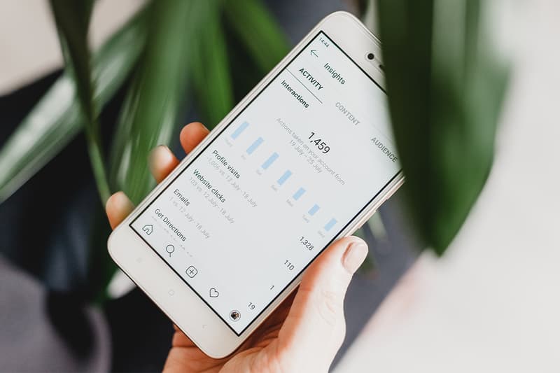 Woman Using iPhone Instagram Insights
