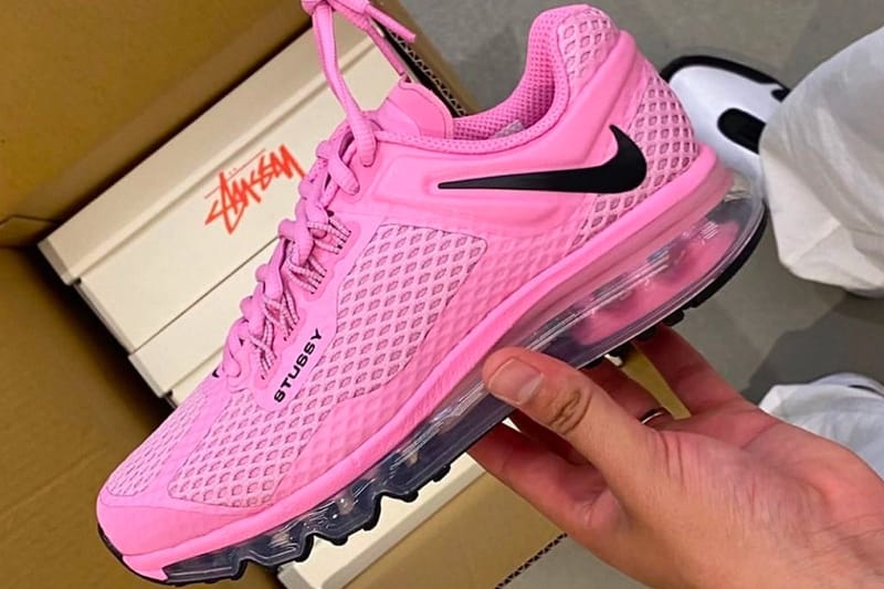 black nike sneakers with pink bottoms