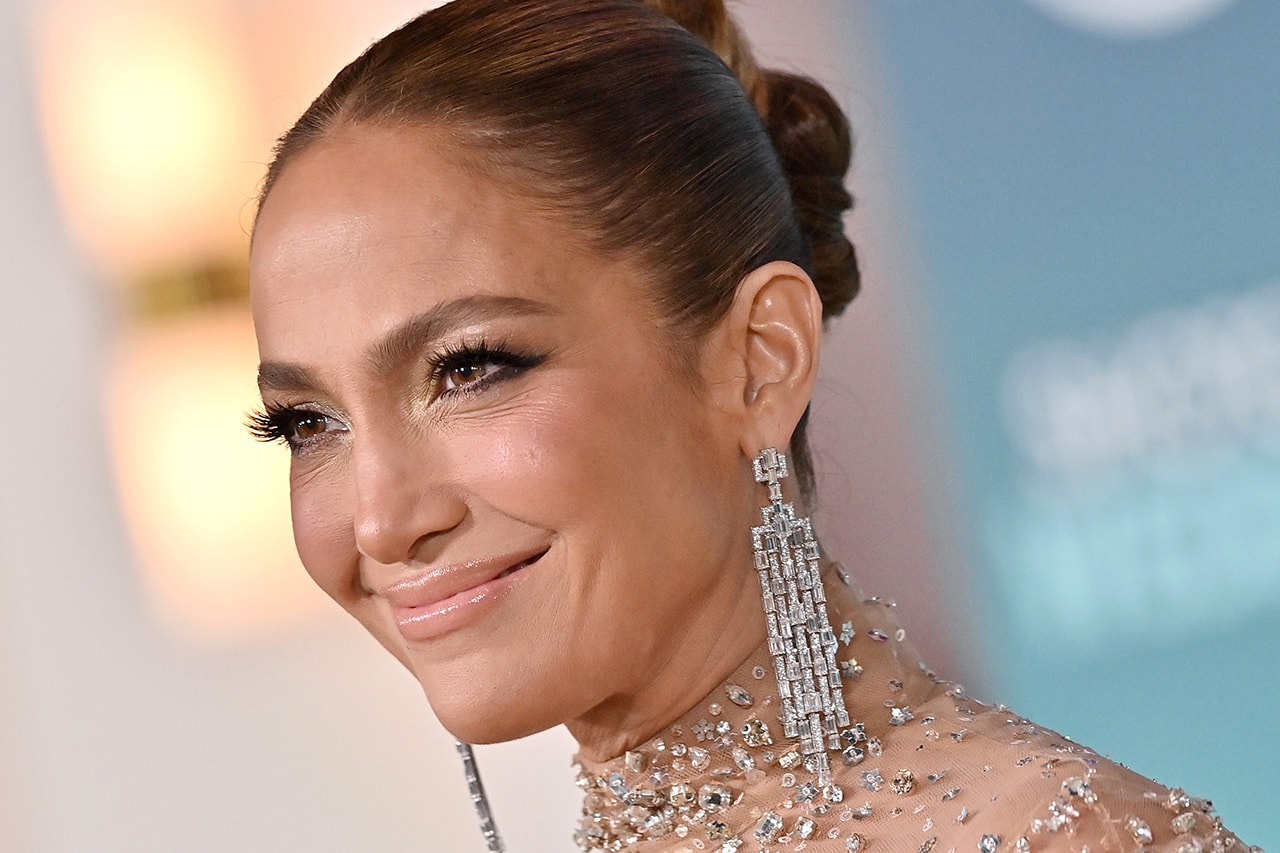 Jennifer Lopez shotgun wedding premiere bun hairstyle photos instagram