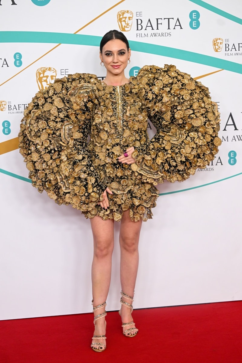 Hoyeon Jung Shines in Gold Dress & Heels at BAFTA Red Carpet 2023