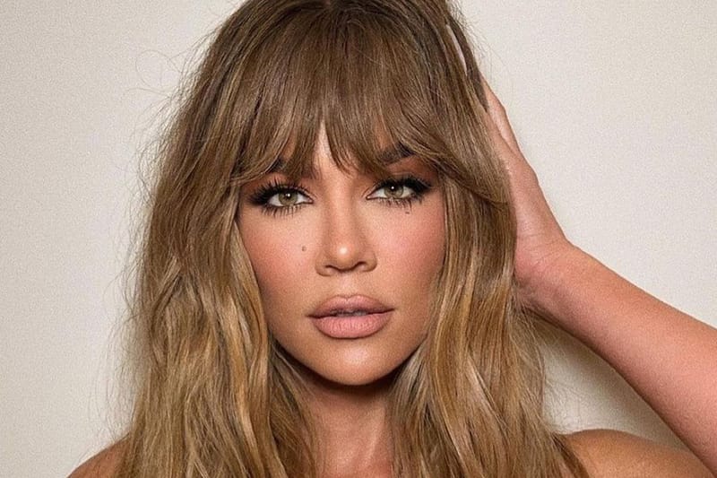 Leave It to Khloé Kardashian To Eat Up Pamela Anderson's Iconic, '90s G-String Updo