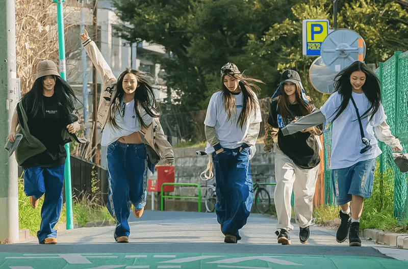 NewJeans Taps Streetwear Icon Hiroshi Fujiwara for New Apparel Collection