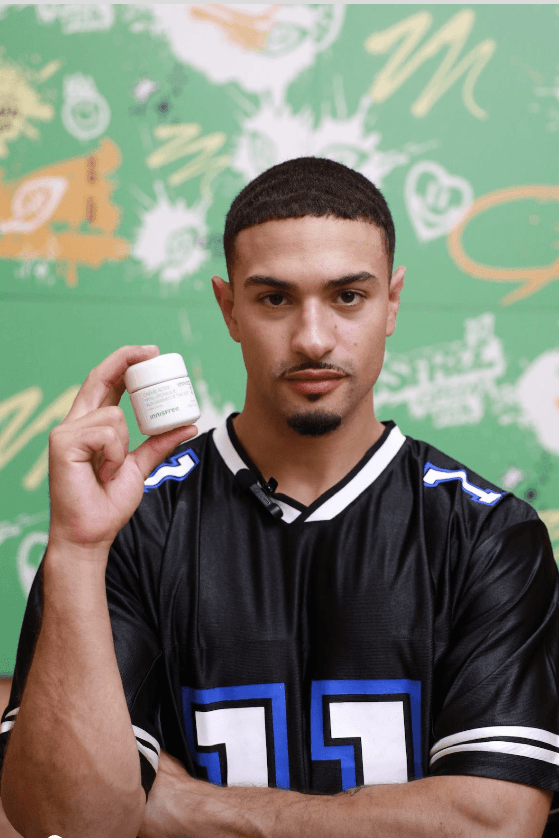 love island, miguel harichi, beauty, skincare, innisfree green tea, man holding bottle