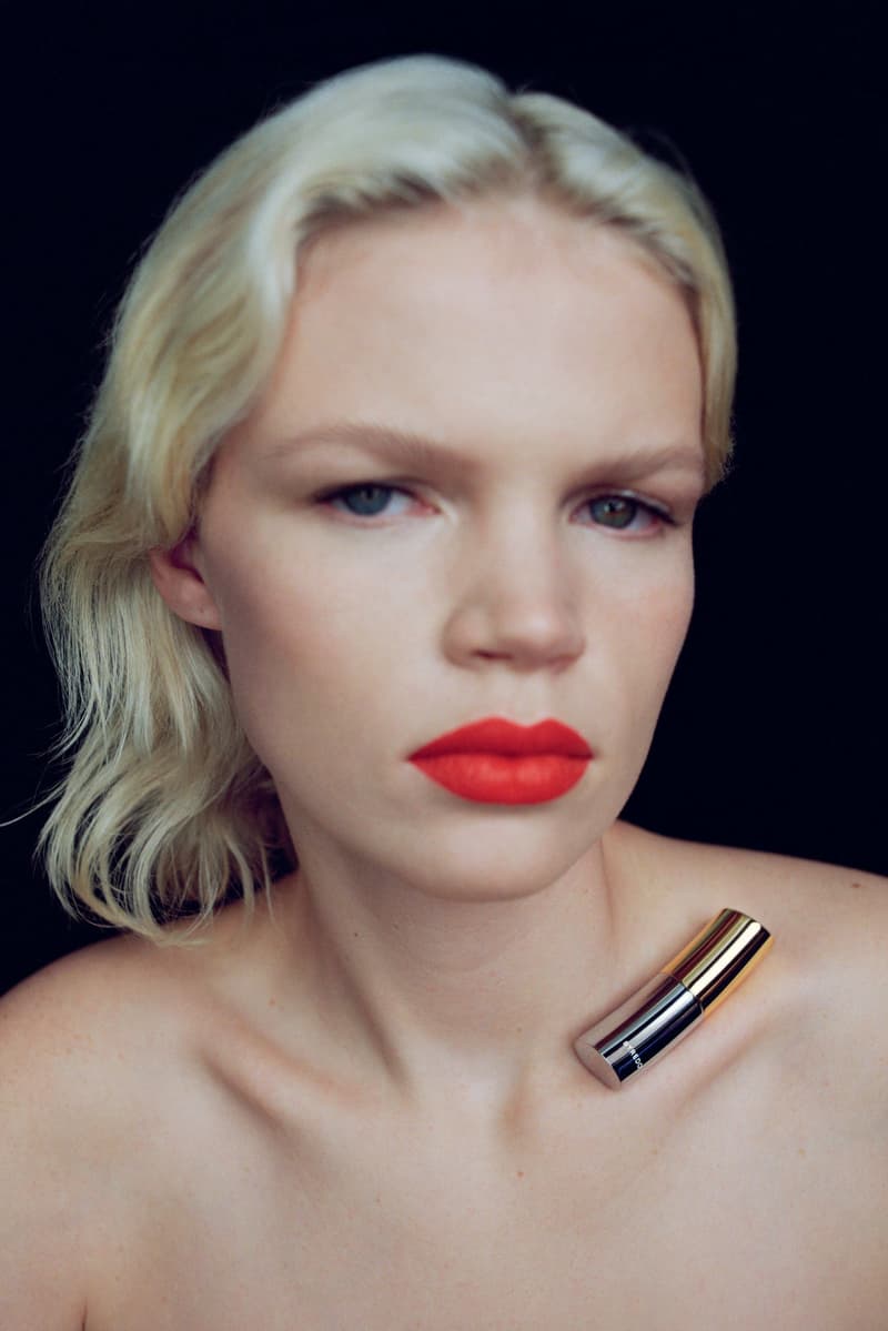 byredo, new lipstick launch, makeup, woman with red lipstick and makeup product on her chest