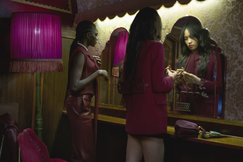 gucci blondie kelsey lu woman body red background suede brown bag