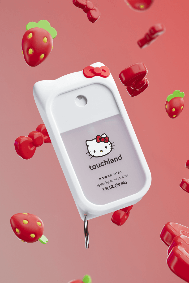 woman with bob surrounded by hello kitty sanrio touchland hand sanitizers, beauty, 50th anniversary