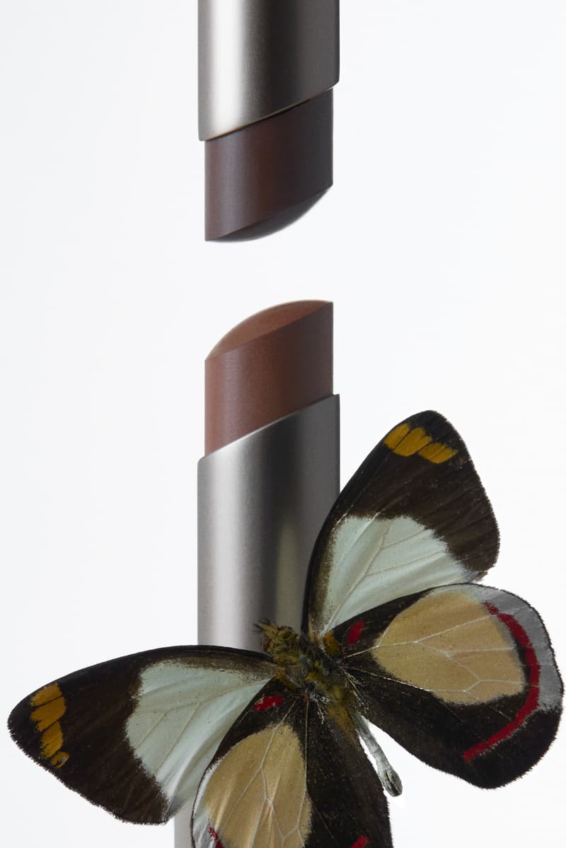 kim kardashian posing with red hair and new skkn by kim matte lipstick, makeup, skincare, kardashians