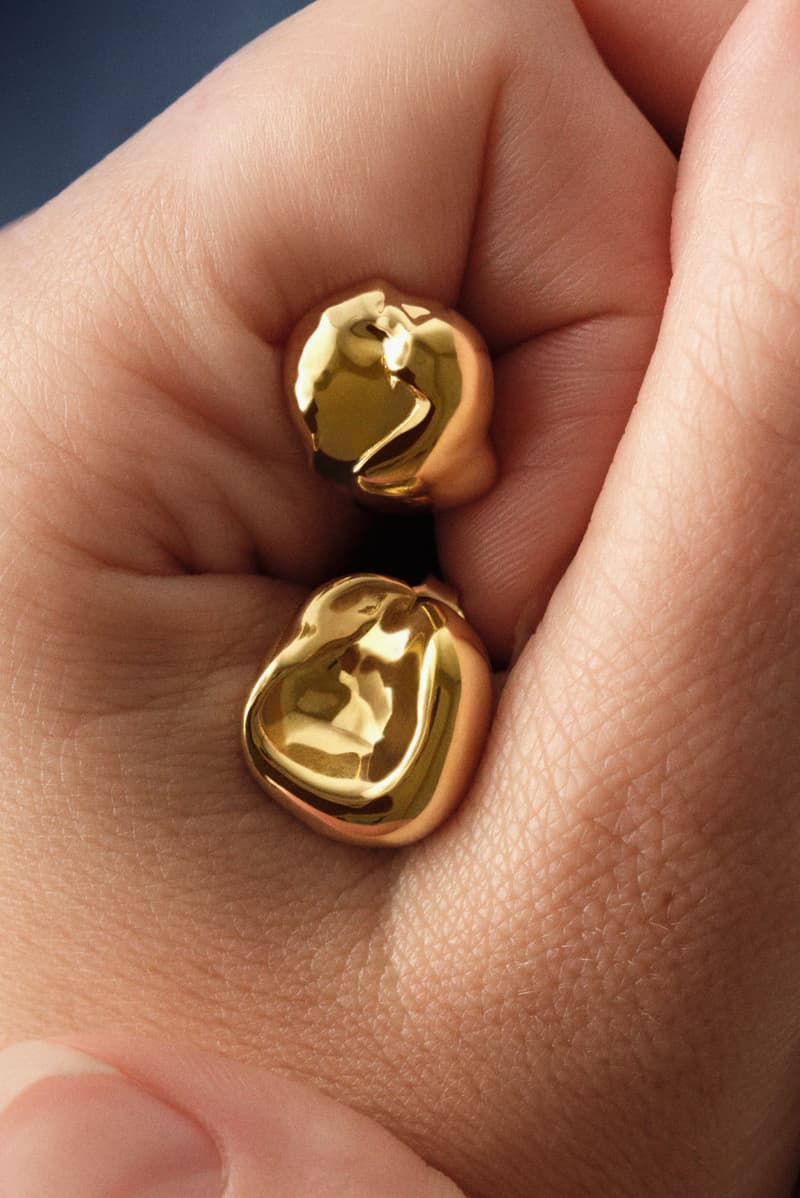 woman wearing merit and completedworks earrings close-up, accessories, fragrance, makeup, skincare