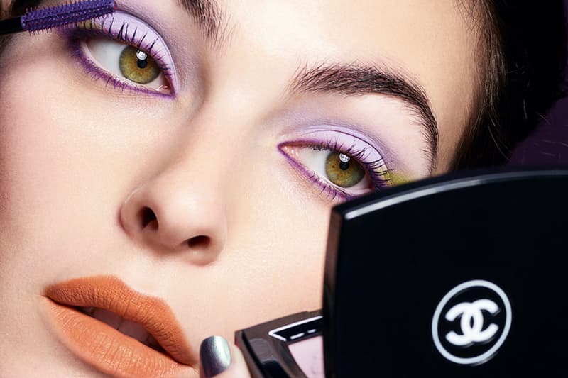 woman with colorful makeup applying mascara, chanel, byredo, isamaya, beauty 