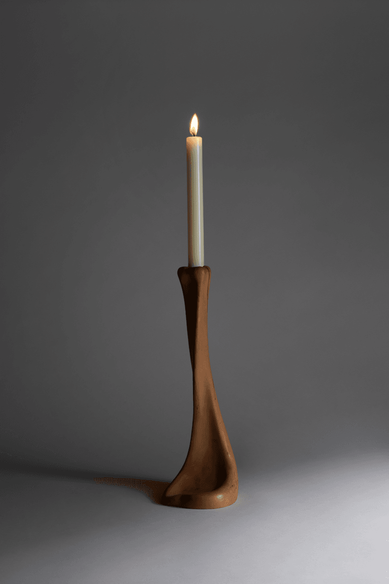 woman caressing bottle of saie beauty glowy super gel in warm glow, swatch of highlighting primer, makeup, skincare