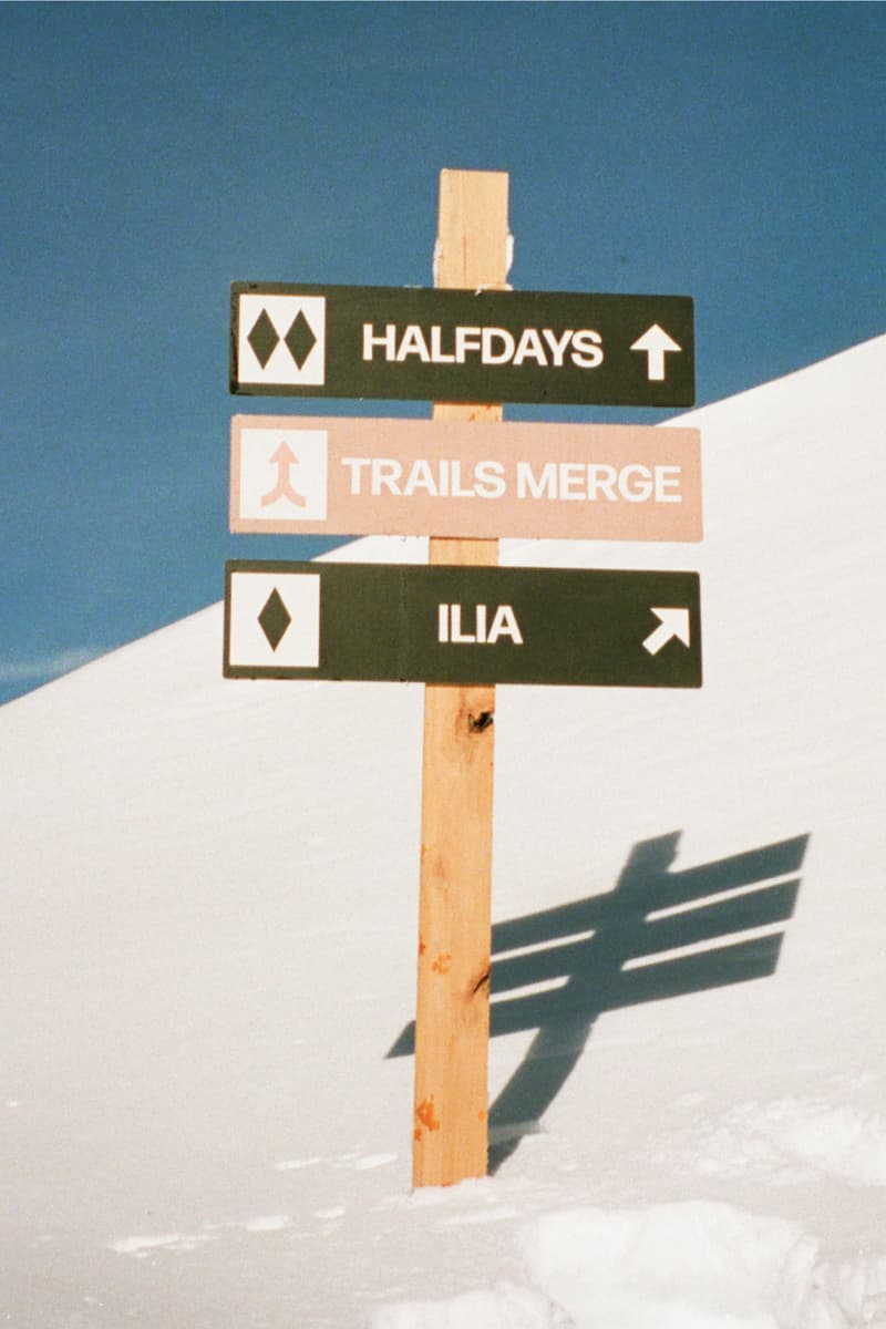 two women with moisturizer in between their faces, woman in a full ski outfit, ilia, halfdays ski suit, sportswear, snow apparel, beauty, skincare, barrier build skin protectant cream, moisturizer