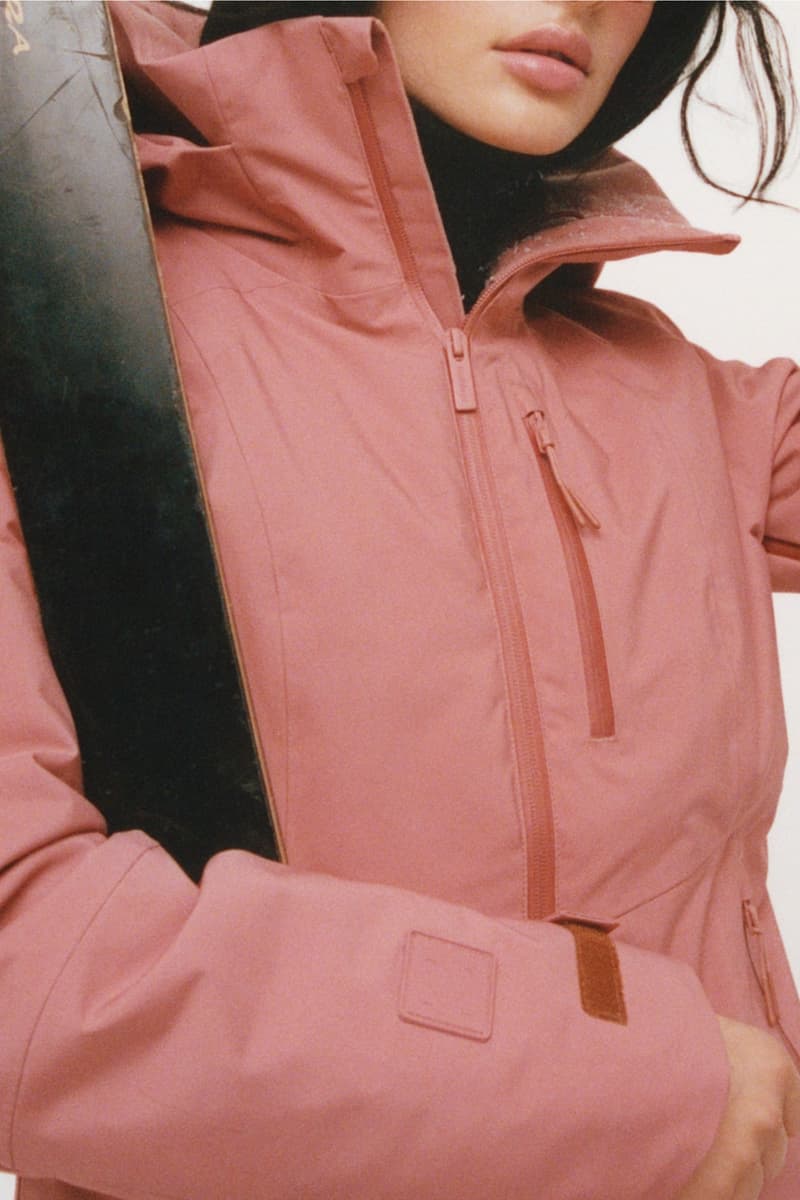 two women with moisturizer in between their faces, woman in a full ski outfit, ilia, halfdays ski suit, sportswear, snow apparel, beauty, skincare, barrier build skin protectant cream, moisturizer