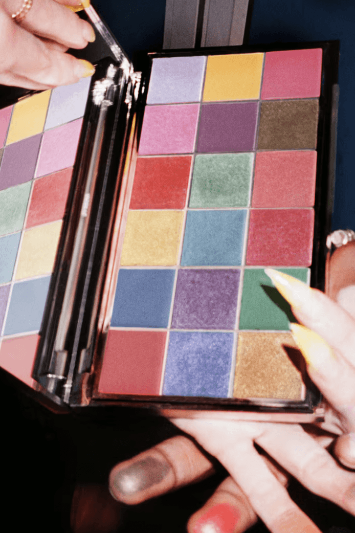 overconsumption in beauty, sustainability in cosmetics, byredo eyeshadow palette with hands and product on them, project pan 2025