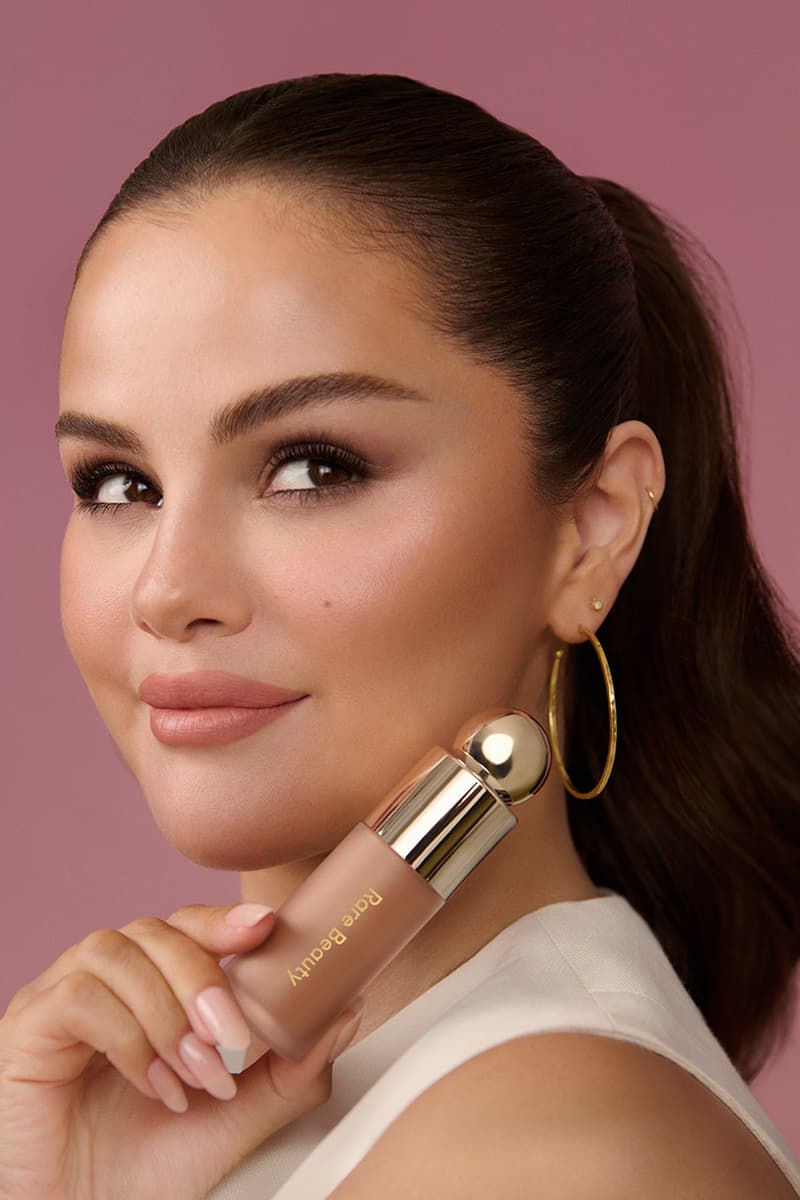 selena gomez posing with new soft pinch liquid contour, bottles of bronzing sculpting contour, new makeup, beauty