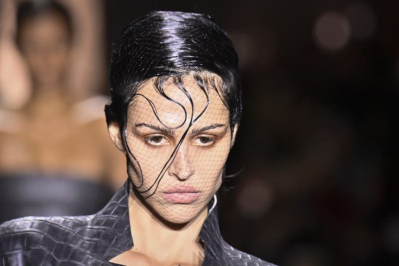 amelia gray wearing wavy hair under fish net at jean paul gaultier, fashion week, couture week beauty trends