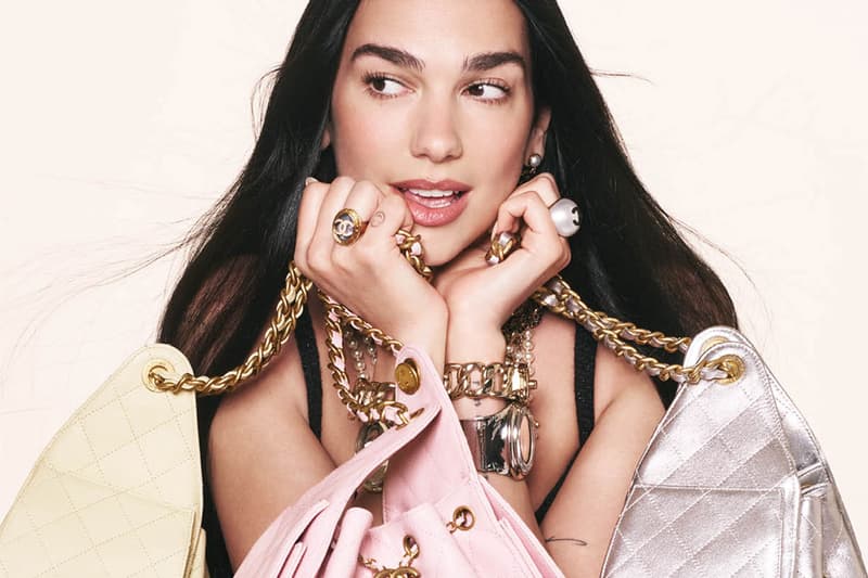 dua lipa holding chanel handbags leather gold chains jewelry