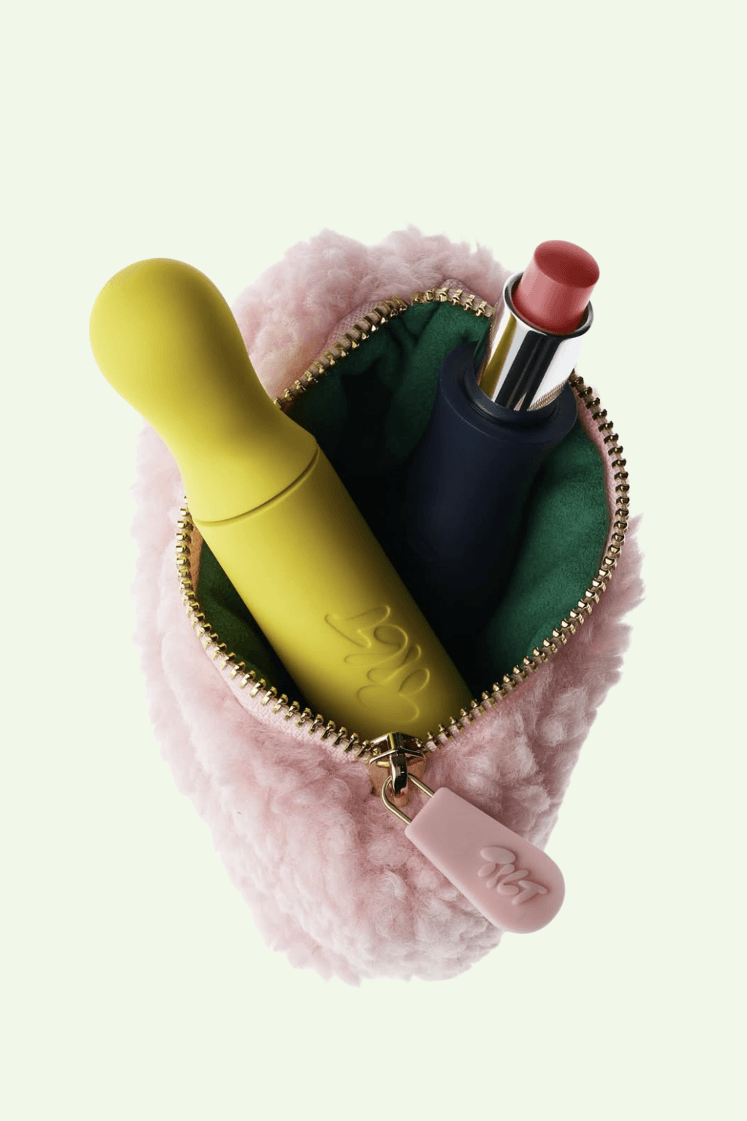 model holding tilt makeup product, accessible beauty, soriatic arthritis
