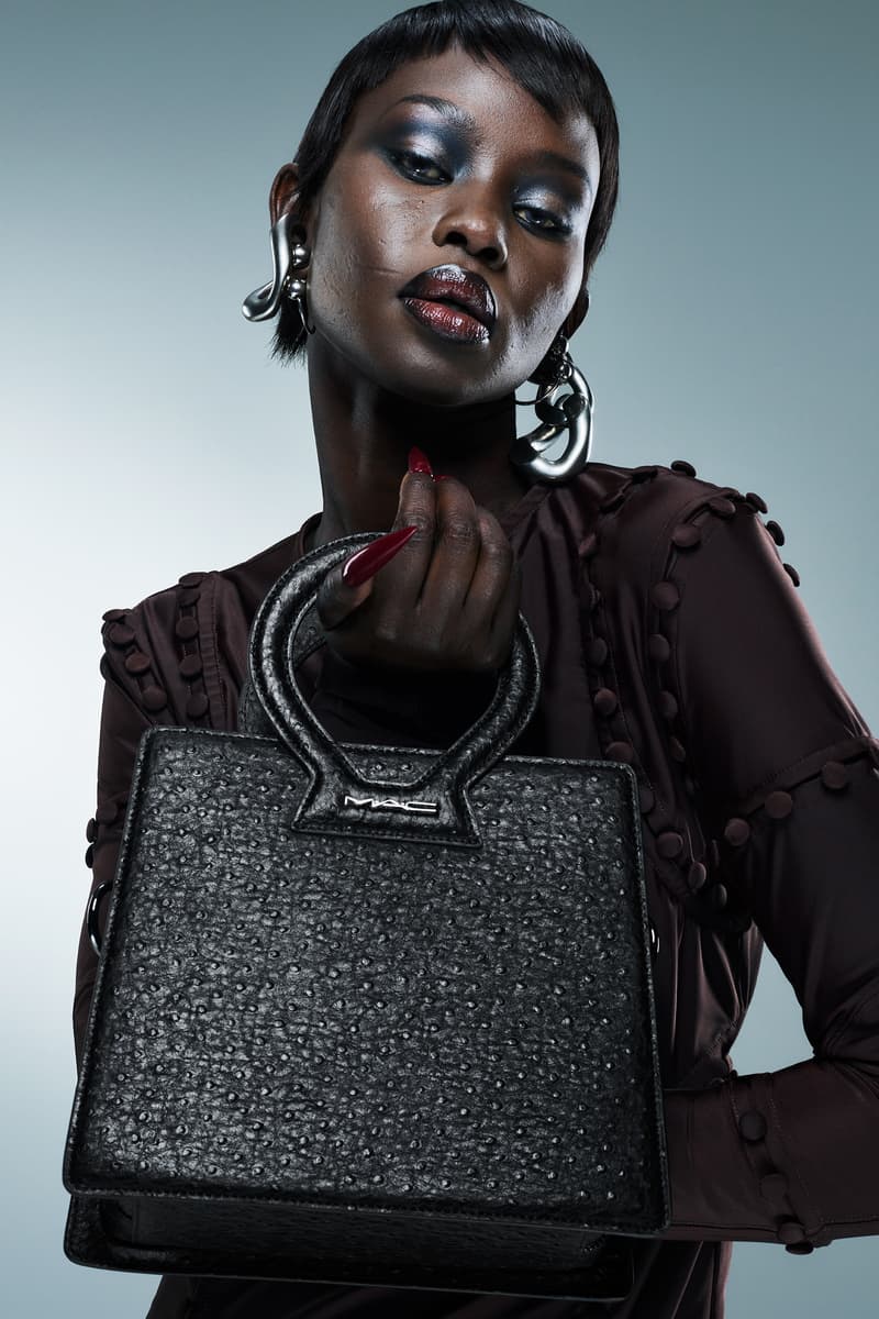 model aweng ade-chuol holding a luar and mac cosmetics bag, new ana artistry purse, fashion week, makeup, beauty