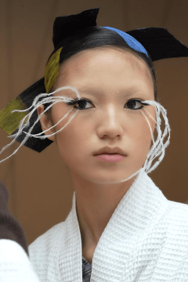 isamaya ffrench applying feather eyelashes, lashify beauty, thom browne, nails, makeup, hair