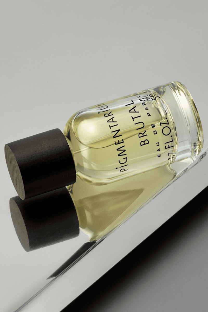 fragrance on chrome tray with negroni drink, pigmentarium "brutal" perfume, beauty