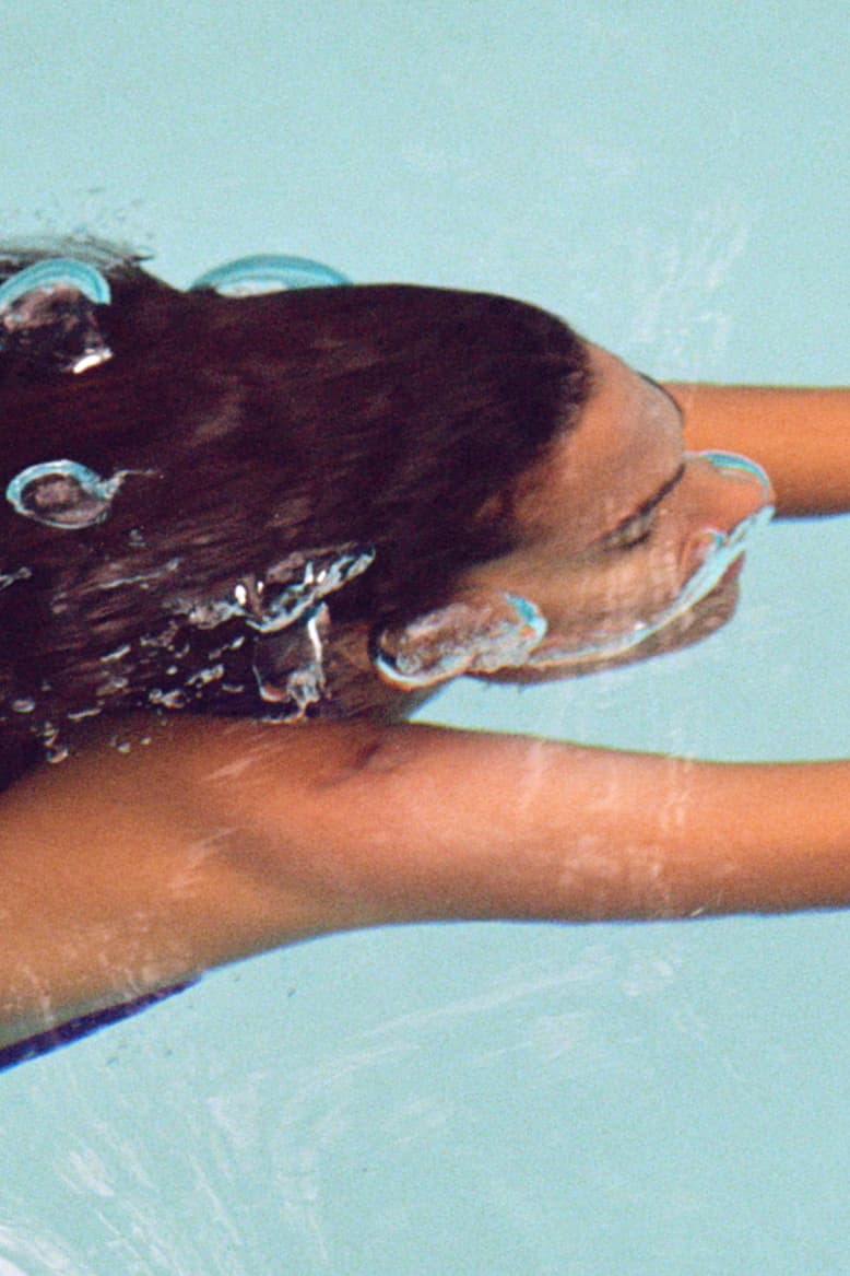 tina kunakey swimming in a pool in purple bathing suit, emma lewisham sunscreen, sunceutical collection mineral SPF 50 face body crèmes, skincare, beauty