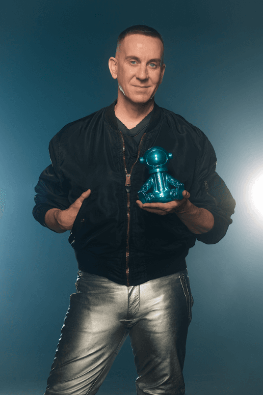 jeremy scott holding a small astronaut with spoiled child skincare inside, beauty