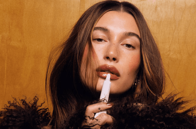 photo of hailey bieber using rhode products, skincare, beauty company sale