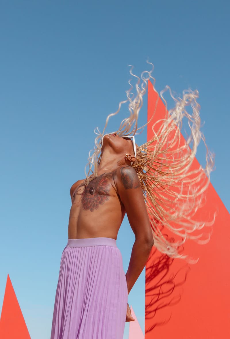 woman with braids flipping her hair, "stop trying to give me my boobs back" photo series, breast cancer, flat closure mastectomy