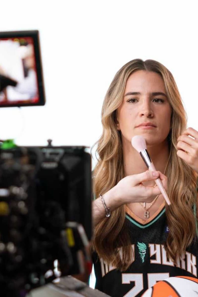 new york liberty player posing with new jersey of fenty beauty and fenty skin, beauty, makeup, skincare