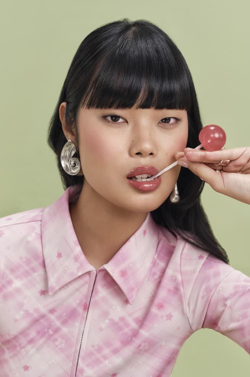 woman licking lollipop, eadem chou chou lip balm in guava fresca skincare makeup beauty