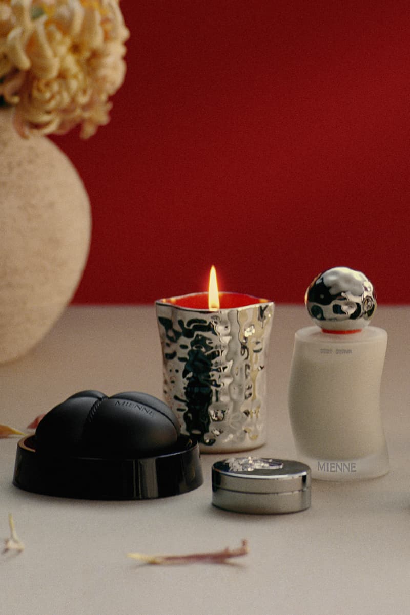 julia fox posing with mienne products on white bed, luxury skincare brand