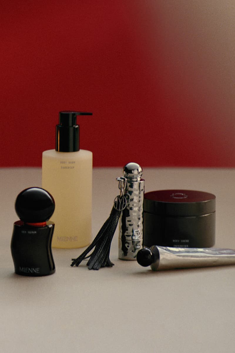 julia fox posing with mienne products on white bed, luxury skincare brand