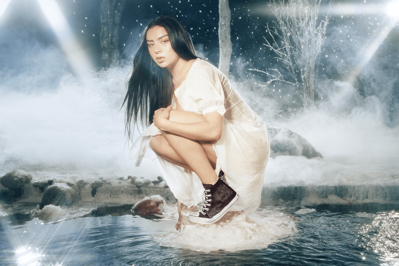 charli xcx, converse, white sneakers, girl laying, singer