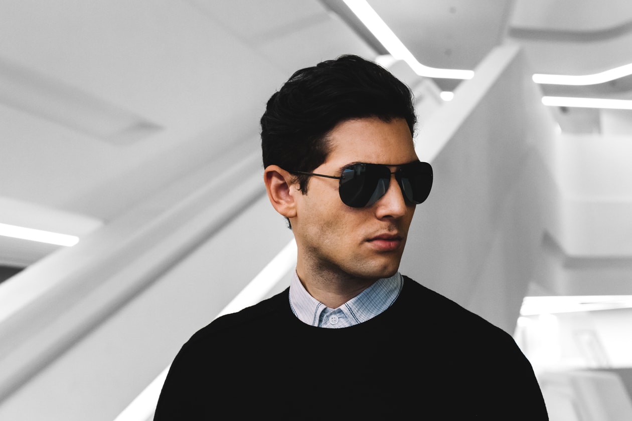 モダンでエレガントなプラダ リネア・ロッサのサングラスをかけて出かけよう