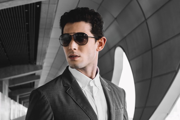 モダンでエレガントなプラダ リネア・ロッサのサングラスをかけて出かけよう
