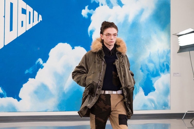 独自のスタイルにミリタリー要素を掛け合わせた Gosha Rubchinskiy 2018年秋冬コレクションを一挙プレイバック トレンドを色濃く反映したスタイルのみならずロシアヘッズたちの髪型や表情にも注目 ロシア エカテリンブルク Gosha Rubchinskiy ゴーシャ ラブチンスキー Burberry バーバリー Levi’s®︎ リーバイス Dr.Martens ドクターマーチン adidas アディダス ドロップショルダー オーバーサイズ コート類 スウェット カラーブロッキング フライトジャケット ワークシャツ HYPEBEAST ハイプビースト
