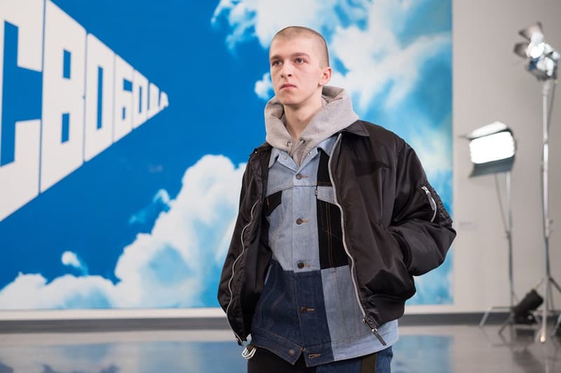 独自のスタイルにミリタリー要素を掛け合わせた Gosha Rubchinskiy 2018年秋冬コレクションを一挙プレイバック トレンドを色濃く反映したスタイルのみならずロシアヘッズたちの髪型や表情にも注目 ロシア エカテリンブルク Gosha Rubchinskiy ゴーシャ ラブチンスキー Burberry バーバリー Levi’s®︎ リーバイス Dr.Martens ドクターマーチン adidas アディダス ドロップショルダー オーバーサイズ コート類 スウェット カラーブロッキング フライトジャケット ワークシャツ HYPEBEAST ハイプビースト